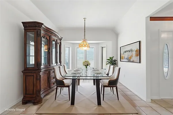 an empty room with closet and windows