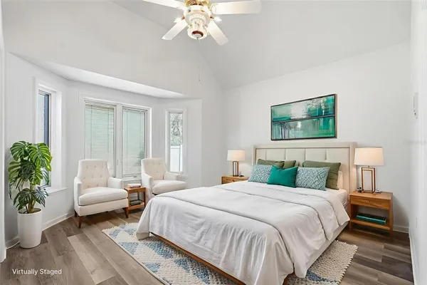 a view of a house with a yard and sitting area