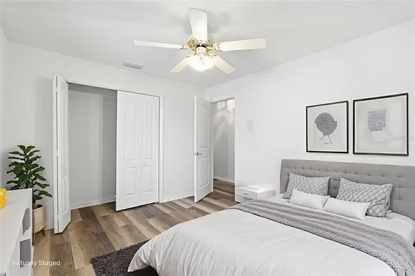 an aerial view of a house with a yard and trees