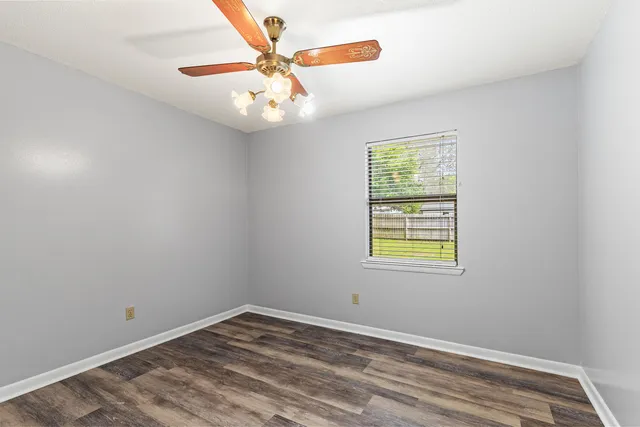 a view of an empty room with a balcony
