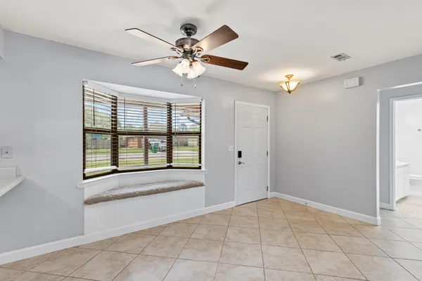 a view of an empty room with a fireplace