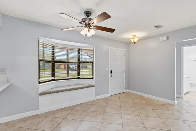 a view of an empty room with a fireplace