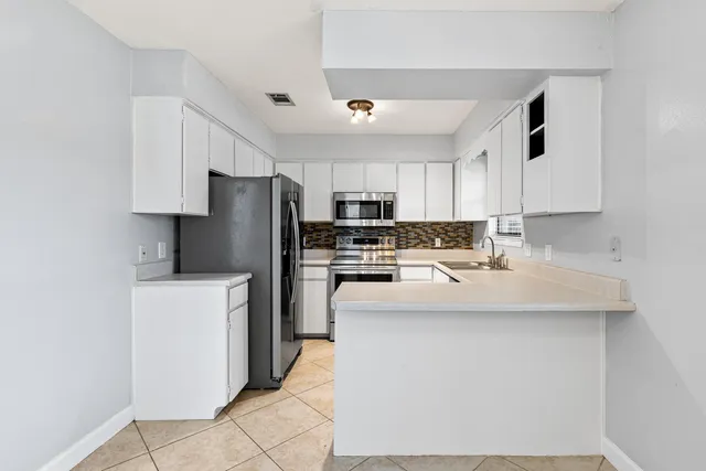 a view of kitchen and utility room
