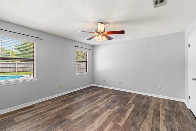 a bathroom with a sink mirror vanity and toilet