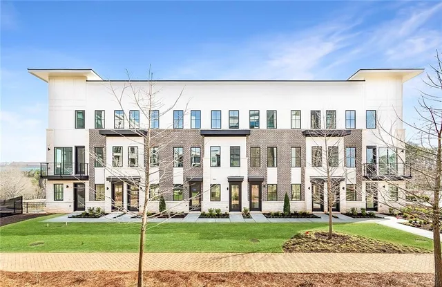 a view of swimming pool with outdoor seating and yard in back