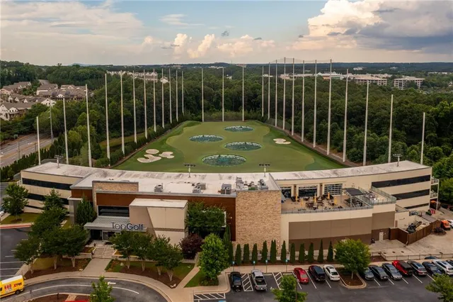a front view of a building with trees