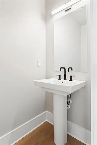 a bathroom with a sink a mirror and shower