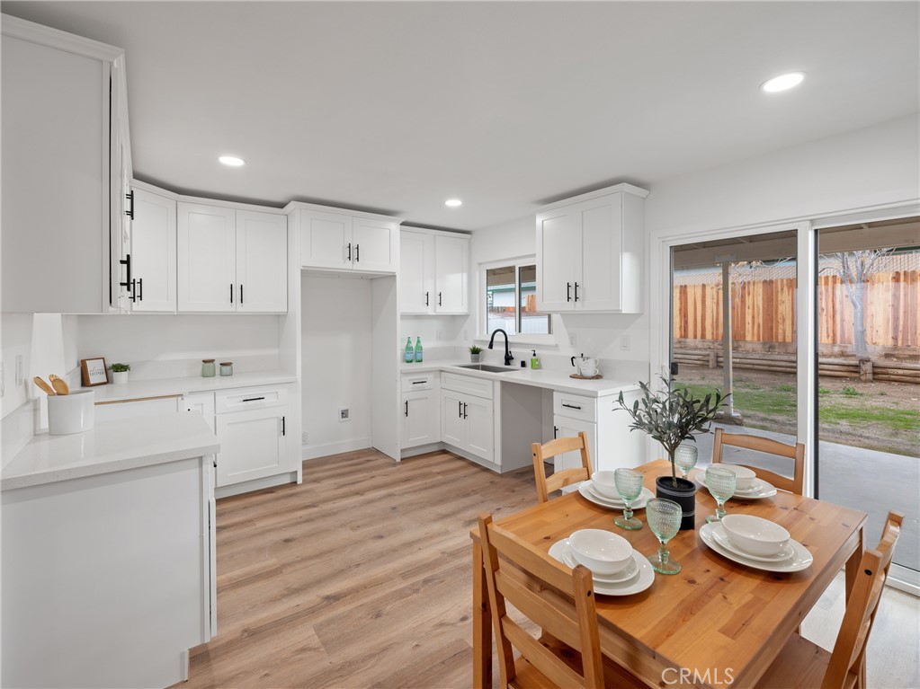 1736 Forane Street Barstow, CA 92311 - Photo 1 of 1 a open dining room with furniture and wooden floor