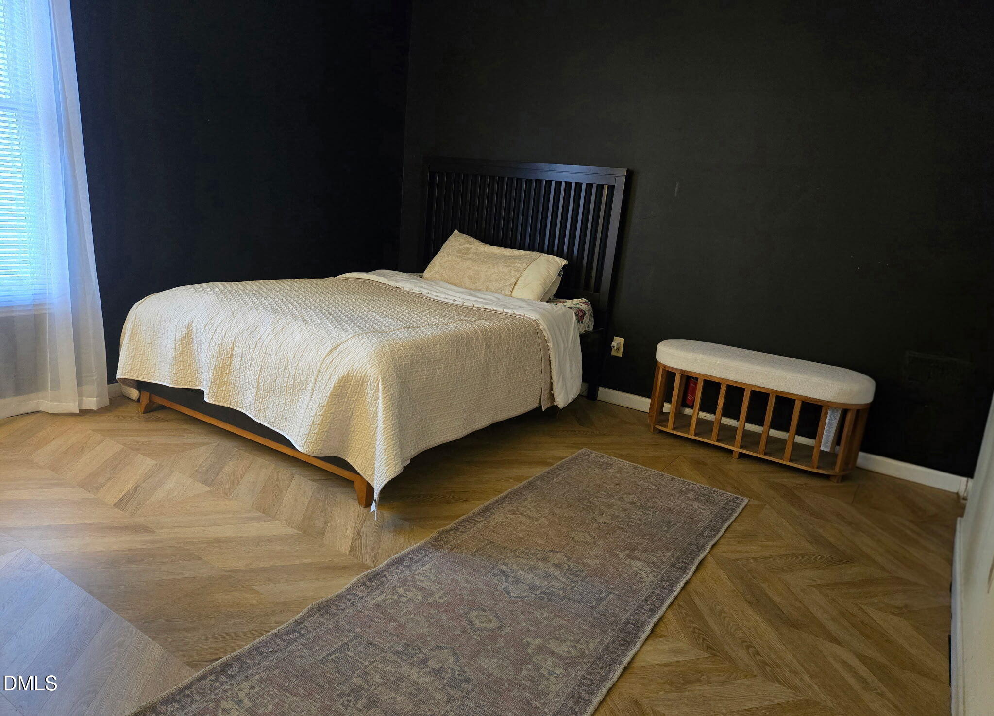 3602 Pine Knoll Drive Raleigh, NC 27604 - Photo 10 of 14 a bed sitting in a bedroom next to a lamp