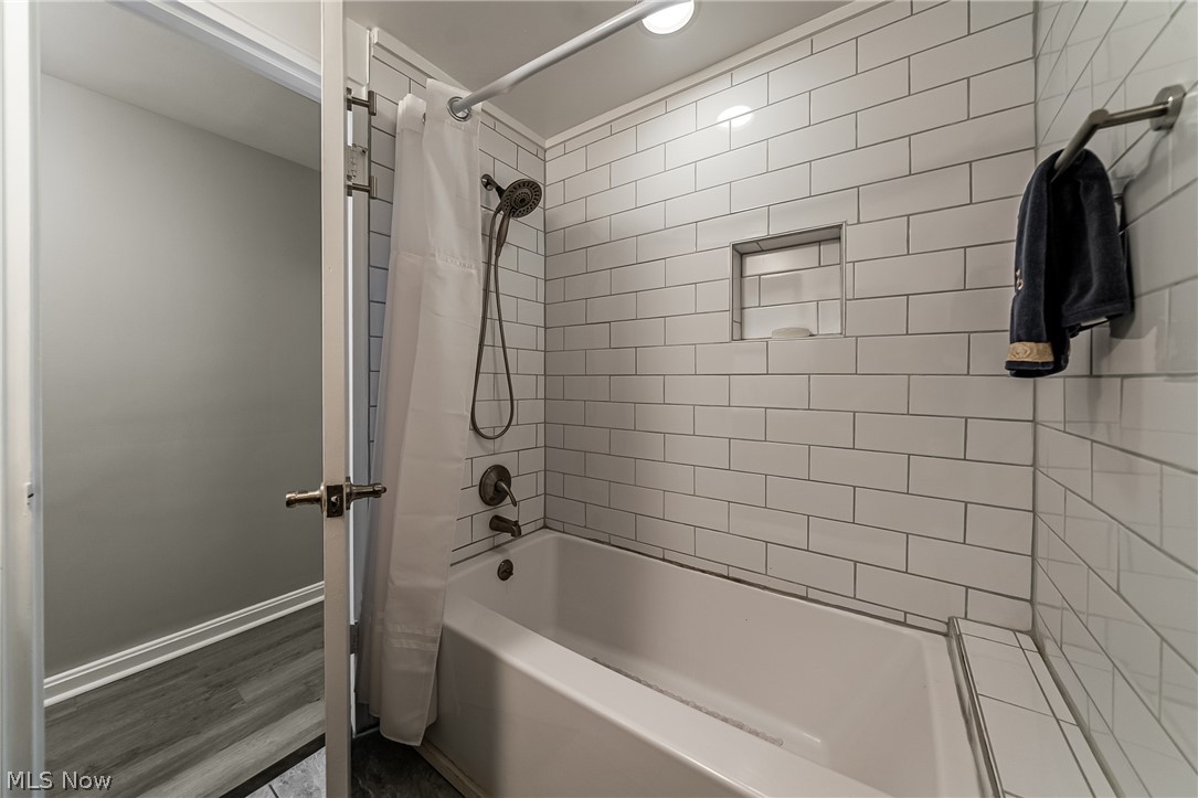 13800 Fairhill Road, Unit 306 Cleveland, OH 44120 - Photo 37 of 48 Full Bathroom featuring shower / bath combination with curtain and recessed lighting