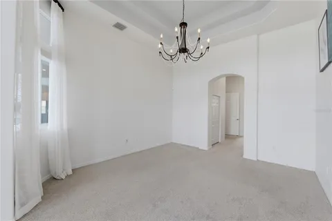 a bedroom with two beds and ceiling fan