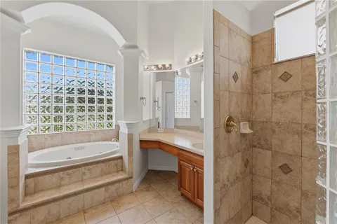 a en suite bathroom with a sink and mirror