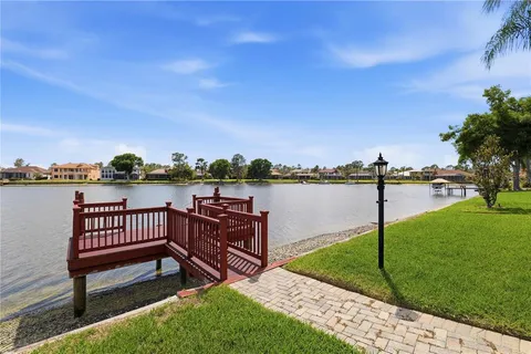 an aerial view of residential houses with outdoor space and street view