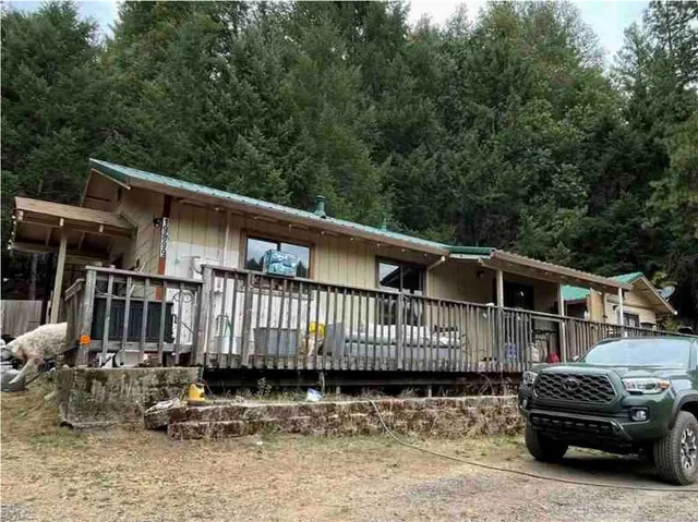 a side view of a house with a yard