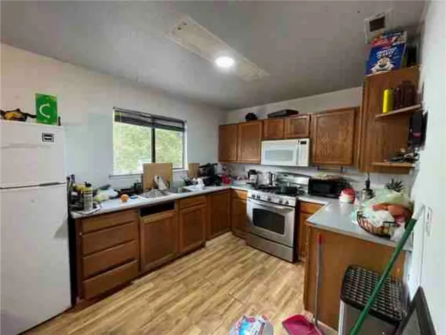 a kitchen with sink cabinets and window