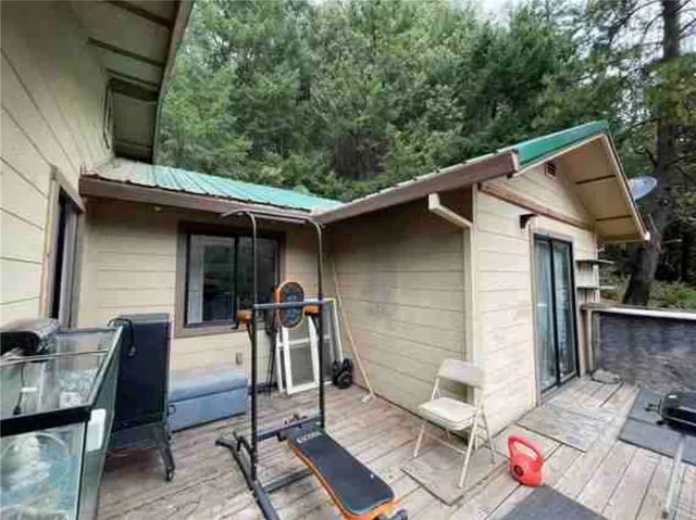 a view of backyard with outdoor seating