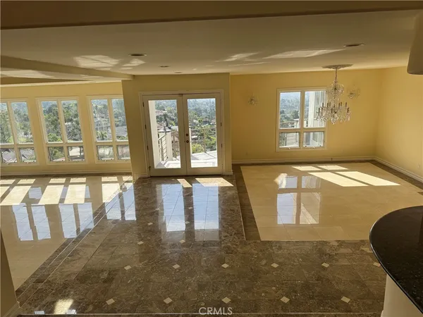 a kitchen with stainless steel appliances granite countertop a sink a stove and refrigerator