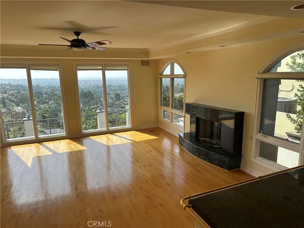 a view of a room with wooden floor