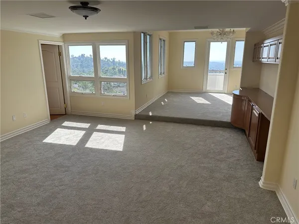 a view of room with wooden floor and fireplace