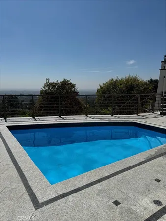 a view of a swimming pool with a chair