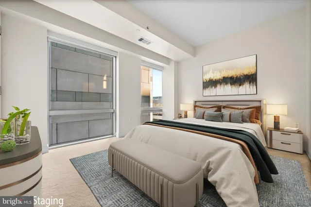 a bedroom with a bed and a window