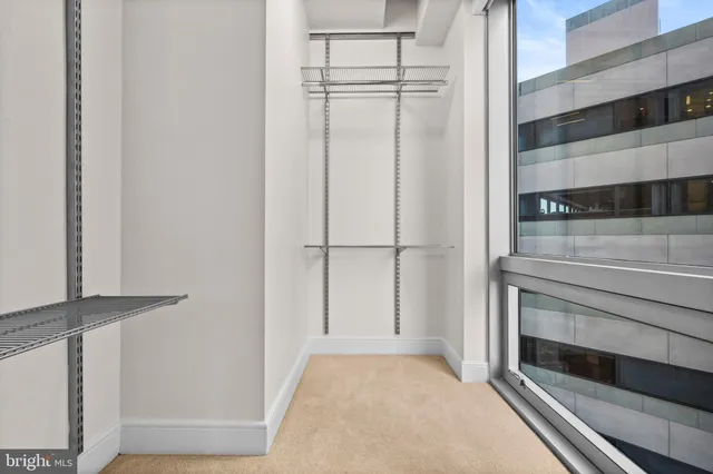 a view of an empty walk in closet