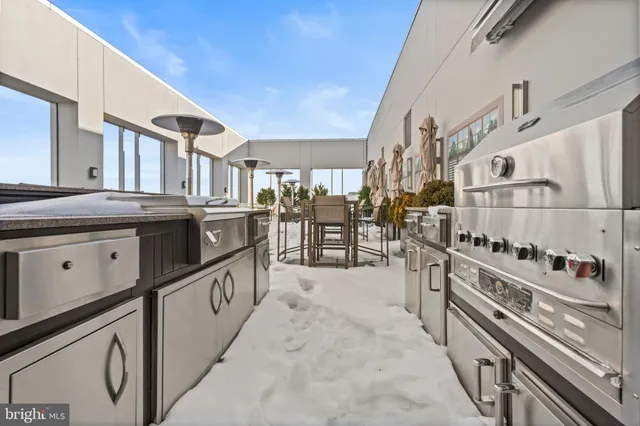 a kitchen with stainless steel appliances granite countertop a stove and a sink