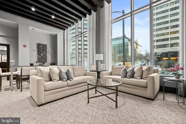 a living room with furniture and a large window