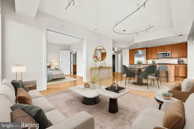 a living room with furniture a outdoor view and kitchen view