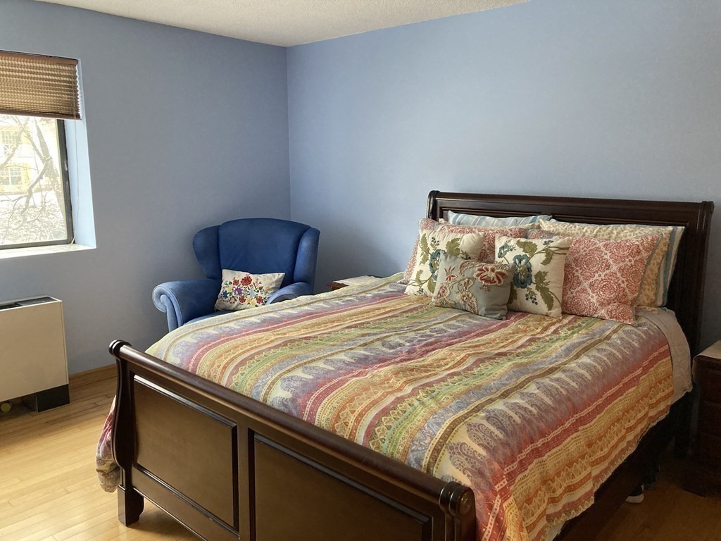 1 Summit Drive, Unit 26 Reading, MA 01867 - Photo 19 of 26 a bedroom with a bed and window