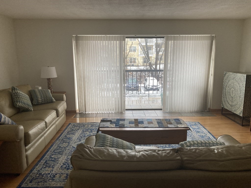 1 Summit Drive, Unit 26 Reading, MA 01867 - Photo 2 of 26 a living room with furniture and a large window