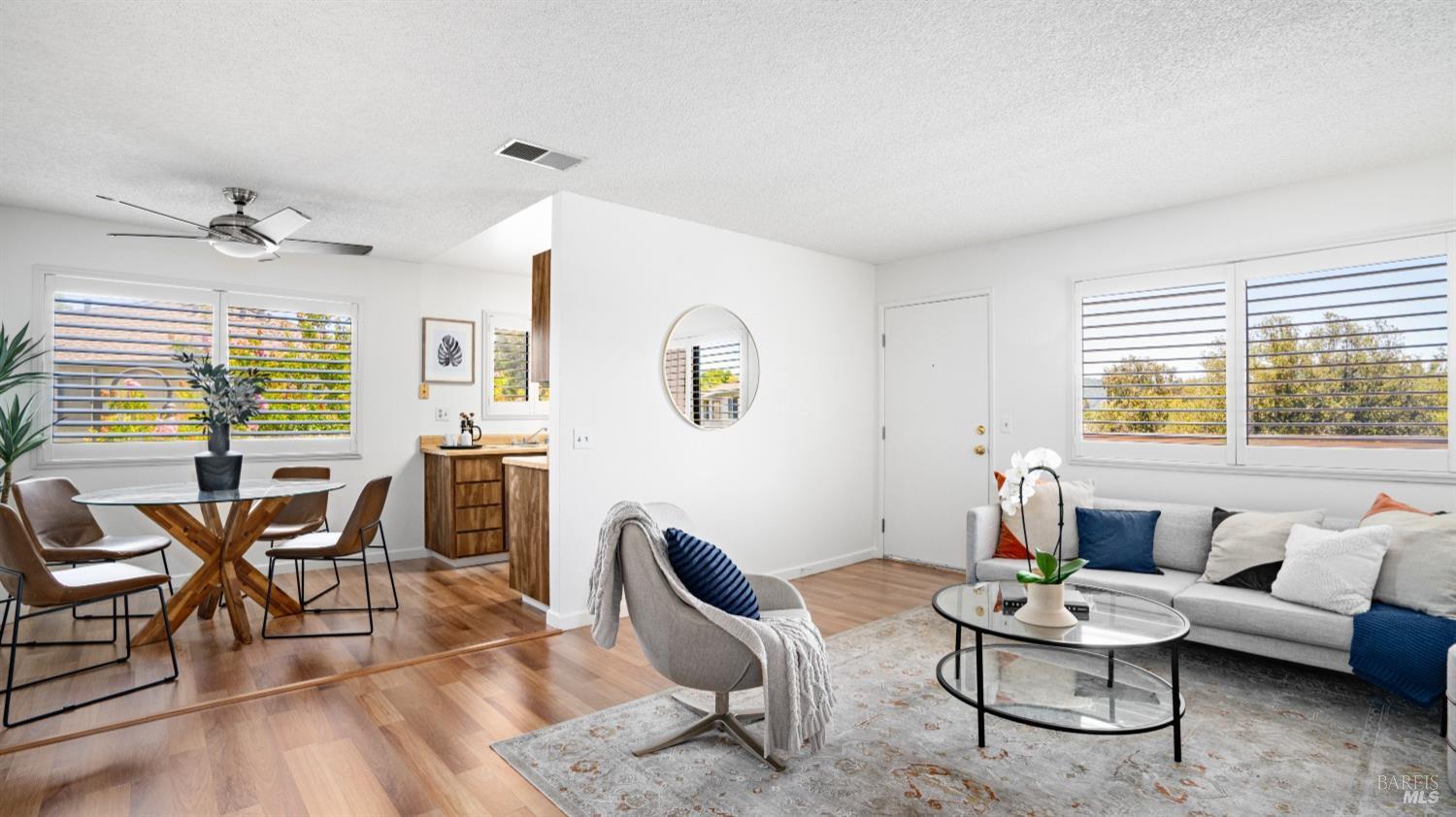 25 Sailmaker Court San Rafael, CA 94903 - Photo 1 of 1 a living room with furniture and a large window
