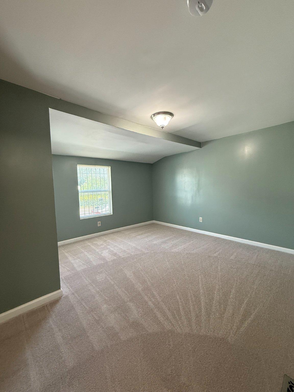 123 Winters Lane Baltimore, MD 21228 - Photo 5 of 28 Spacious room on first floor with soft green hues.