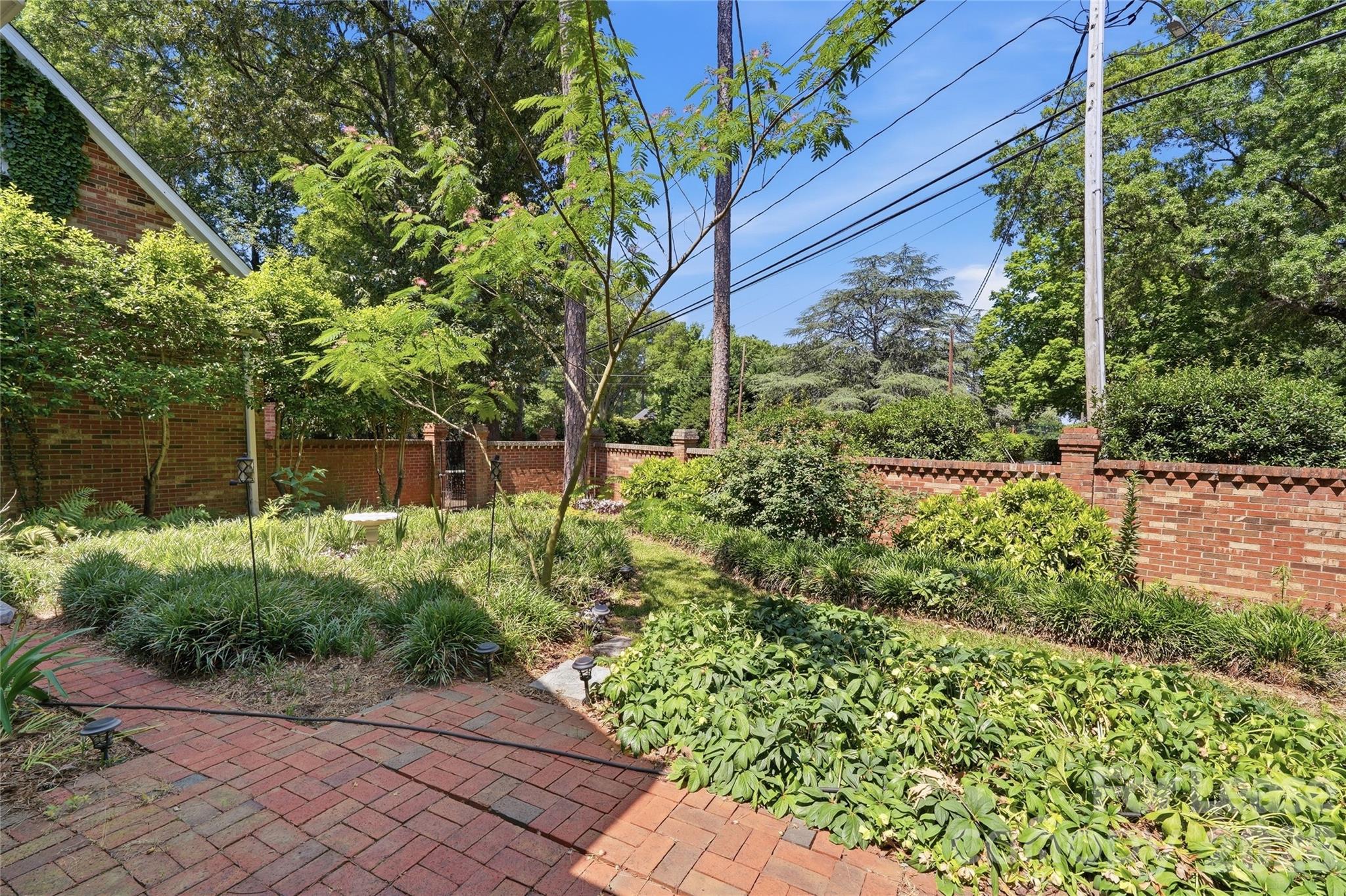 5906 Sharon Hills Road Charlotte, NC 28210 - Photo 28 of 30 a backyard of a house with lots of green space
