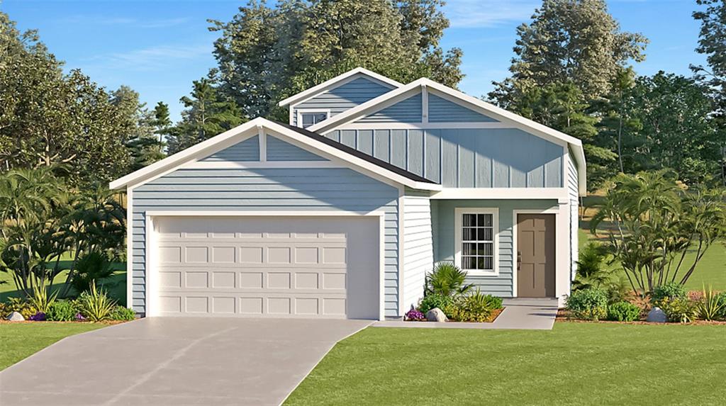 8854 Southwest 68th Ter Road Ocala, FL 34476 - Photo 1 of 1 a front view of a house with a yard