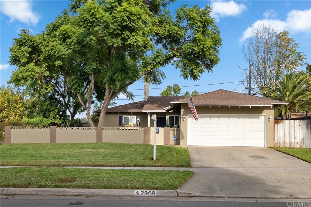 2969 Ronald Street Riverside, CA 92506 - Photo 1 of 1 a front view of a house with a garden