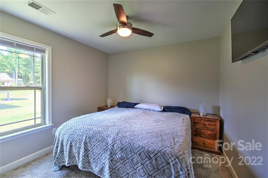 233 Sunward Path Inman, SC 29349 - Photo 12 of 48 a bedroom with a bed and a tv