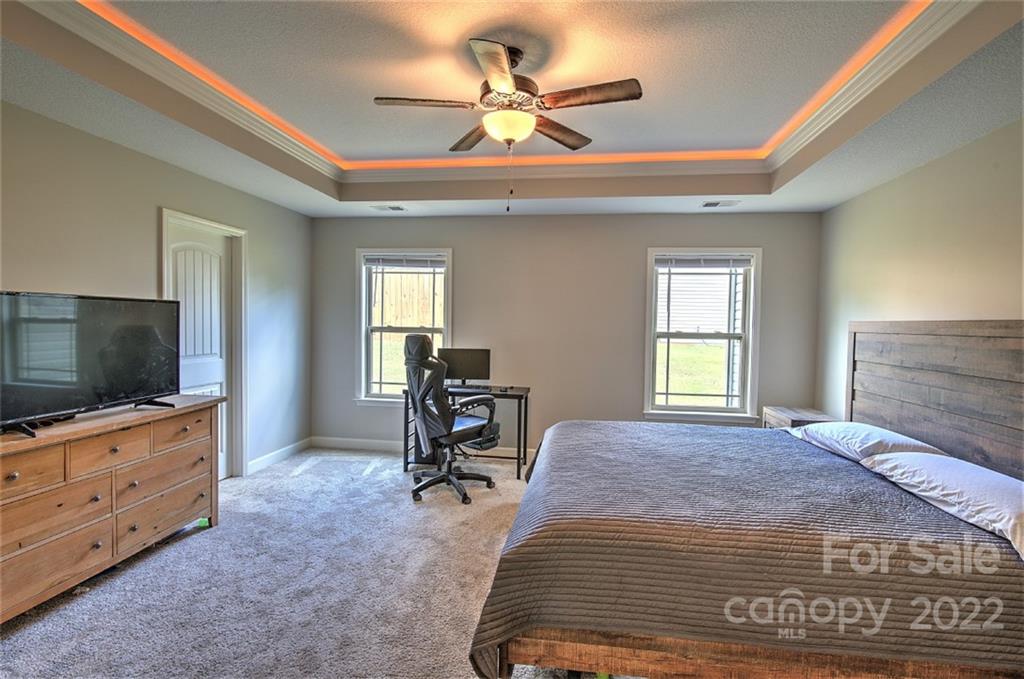 233 Sunward Path Inman, SC 29349 - Photo 14 of 48 a bedroom with a bed and a flat screen tv on dresser
