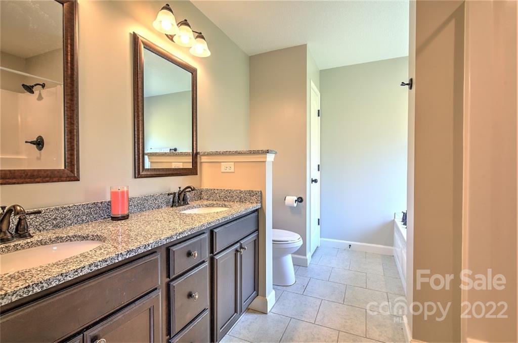 233 Sunward Path Inman, SC 29349 - Photo 17 of 48 a bathroom with a granite countertop sink and a mirror