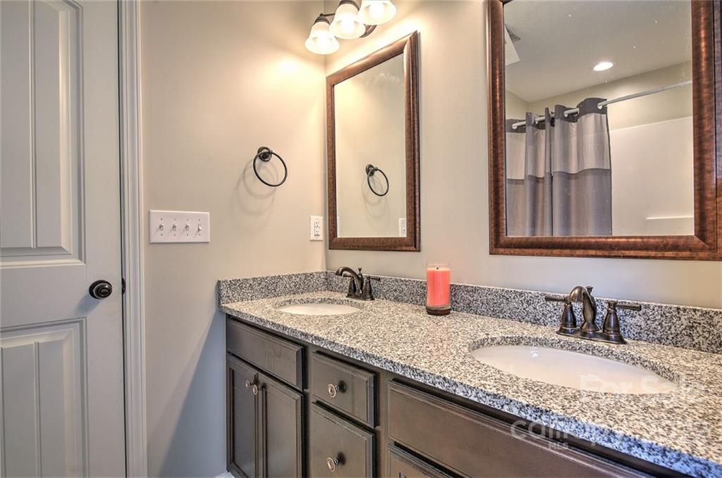 233 Sunward Path Inman, SC 29349 - Photo 19 of 48 a bathroom with a granite countertop double vanity sink and a mirror