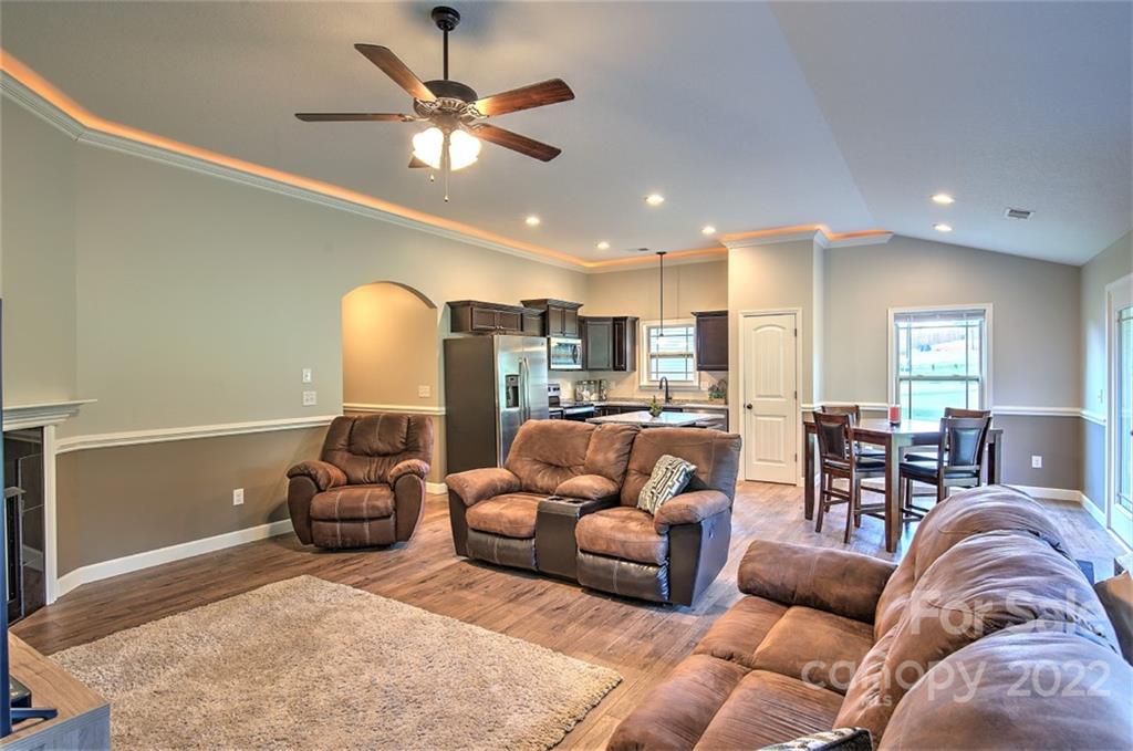 233 Sunward Path Inman, SC 29349 - Photo 23 of 48 a living room with furniture kitchen view and a chandelier
