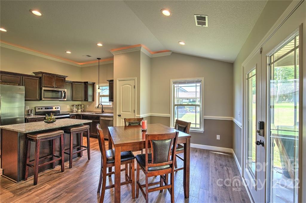 233 Sunward Path Inman, SC 29349 - Photo 28 of 48 a view of a dining room with furniture window and wooden floor