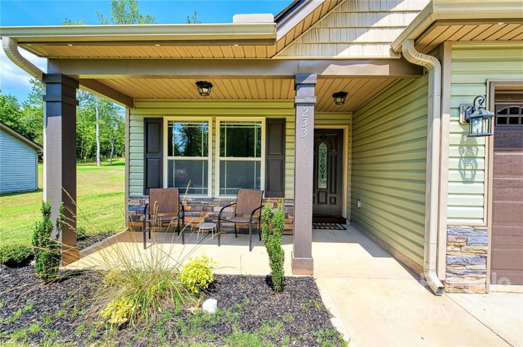 233 Sunward Path Inman, SC 29349 - Photo 4 of 48 a view of a chairs and table in the patio