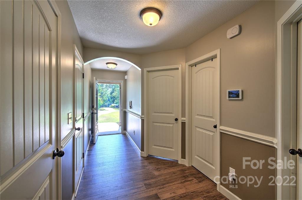 233 Sunward Path Inman, SC 29349 - Photo 8 of 48 a view of a hallway with wooden floor