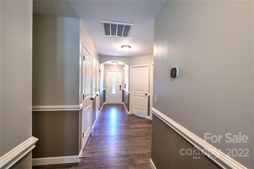 233 Sunward Path Inman, SC 29349 - Photo 9 of 48 a view of a hallway with wooden floor