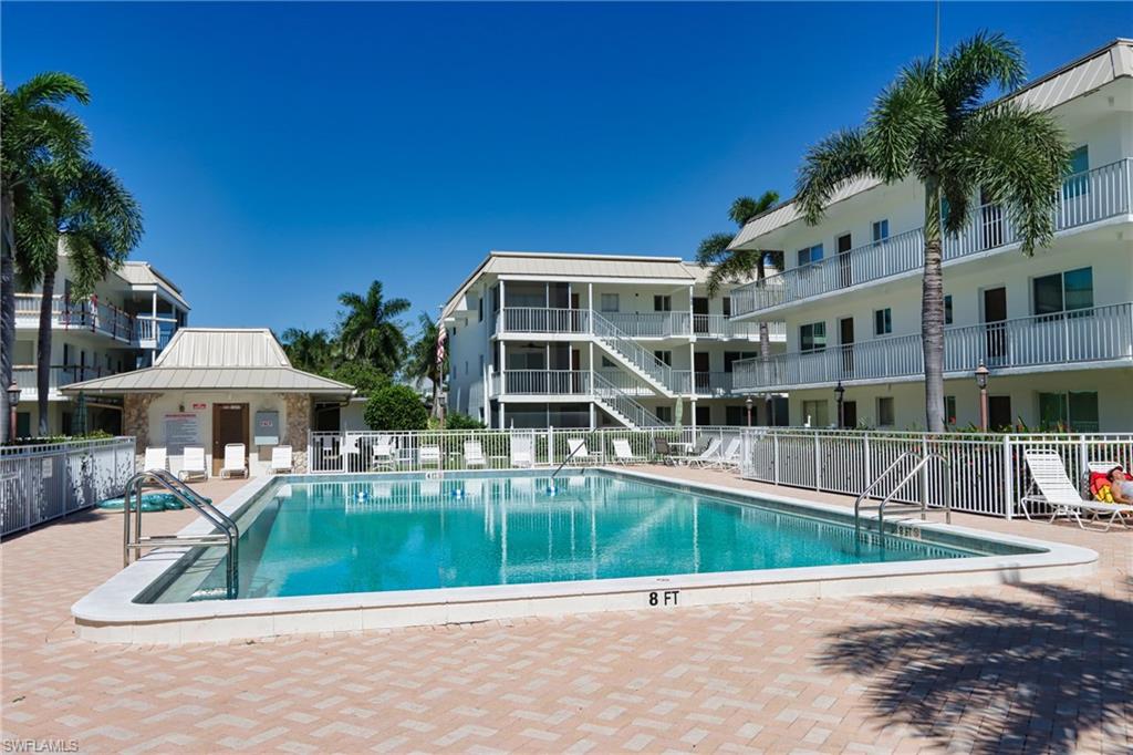 766 Central Avenue, Unit 112 Naples, FL 34102 - Photo 17 of 18 front view of house with a yard