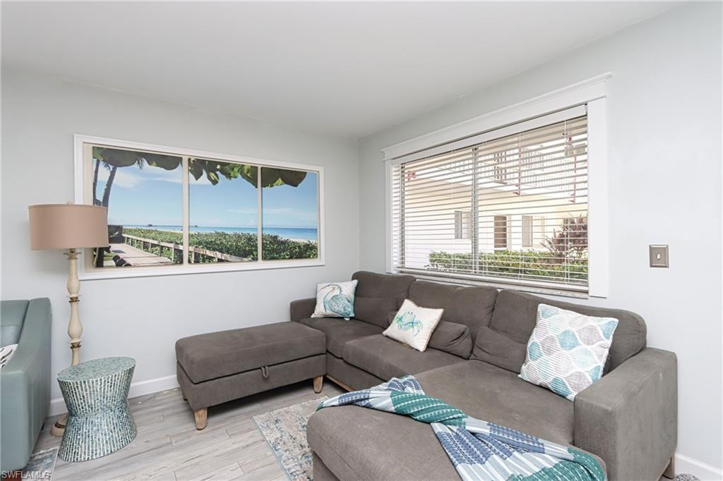 766 Central Avenue, Unit 112 Naples, FL 34102 - Photo 3 of 18 a living room with furniture and a window