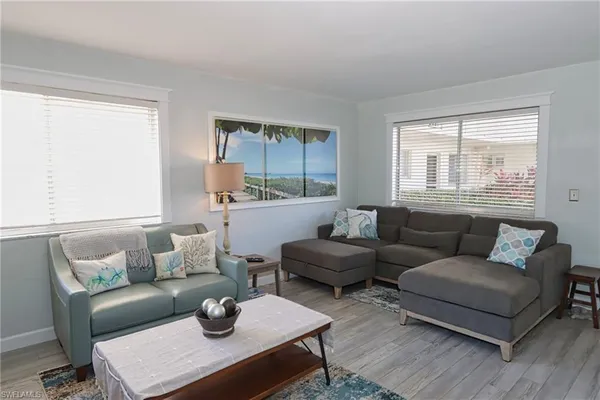 a living room with furniture and a table