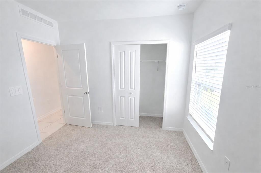1449 Austin Street Lake Wales, FL 33859 - Photo 14 of 18 a view of an empty room with a window