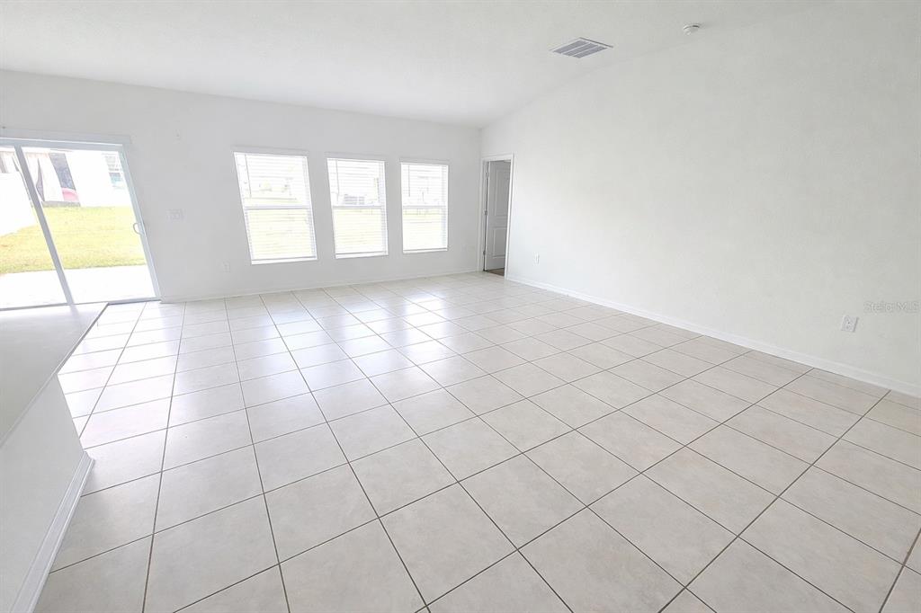 1449 Austin Street Lake Wales, FL 33859 - Photo 5 of 18 a view of an empty room and window